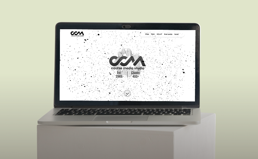 Laptop on a white pedestal displaying the Course Media Studio website homepage with logo and client info.