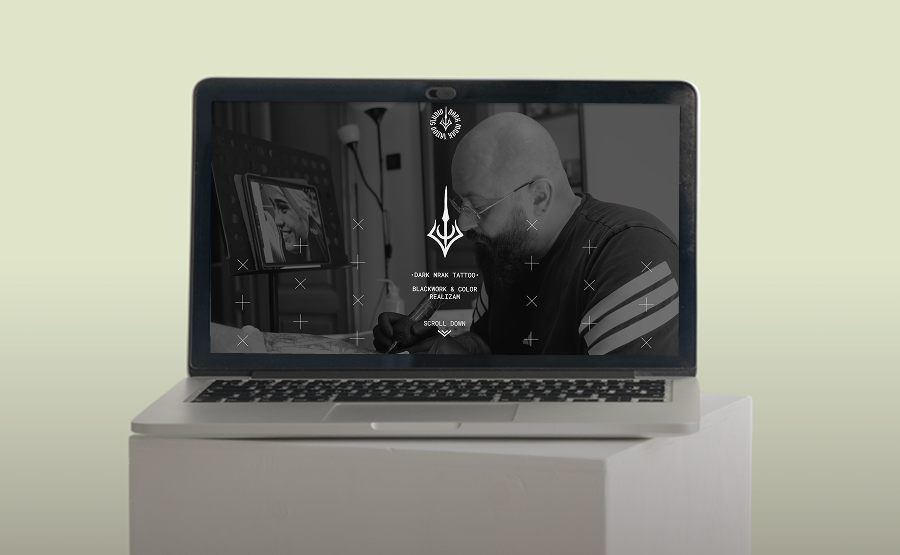 Webflow website design for Dark Mrak Tattoo studio displayed on a laptop screen